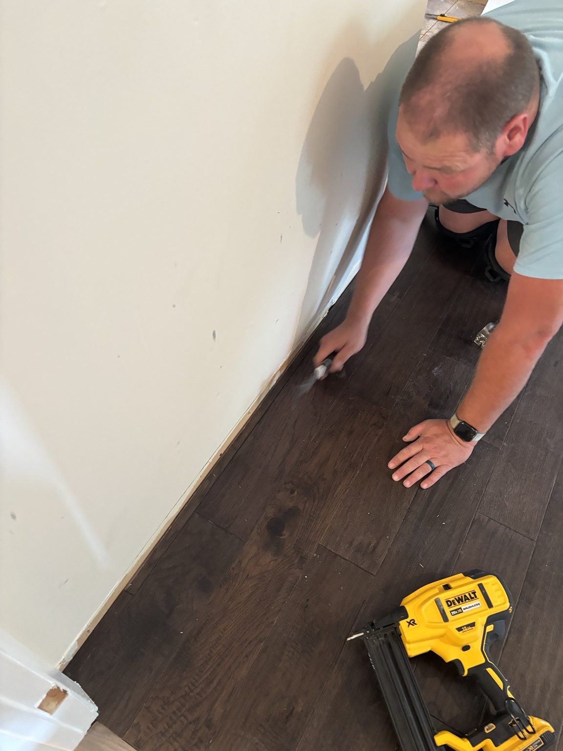Flooring installation detail with Rene working