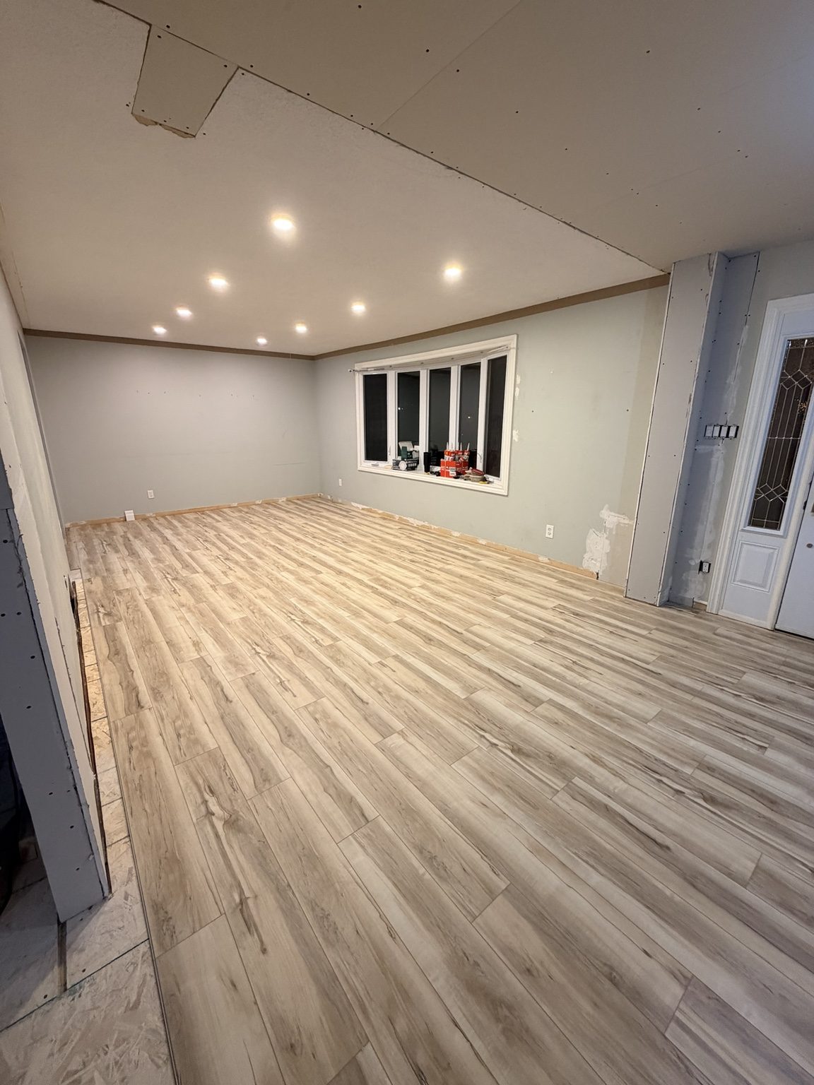 Light finished flooring in larger renovated room