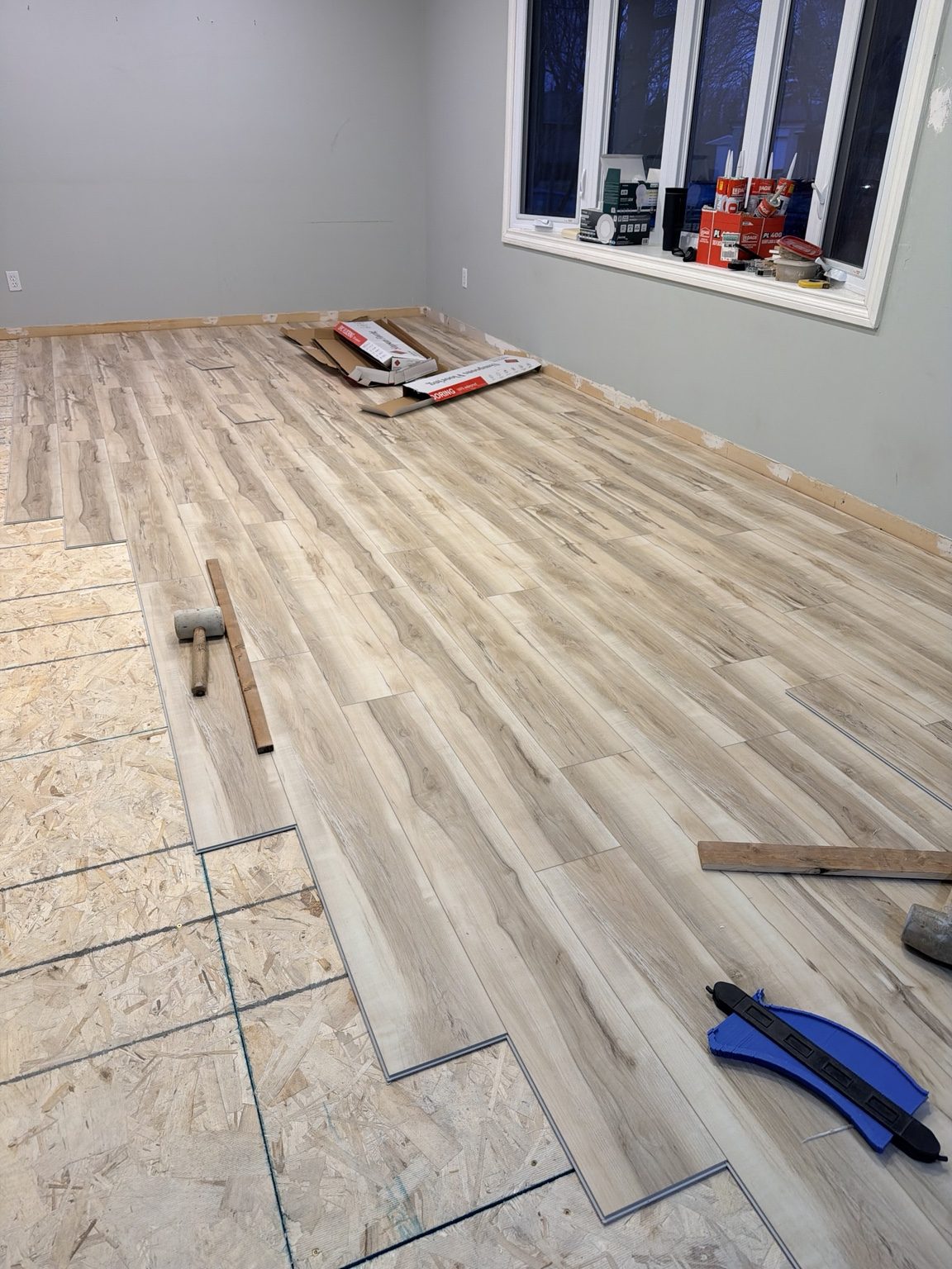 Light flooring being installed